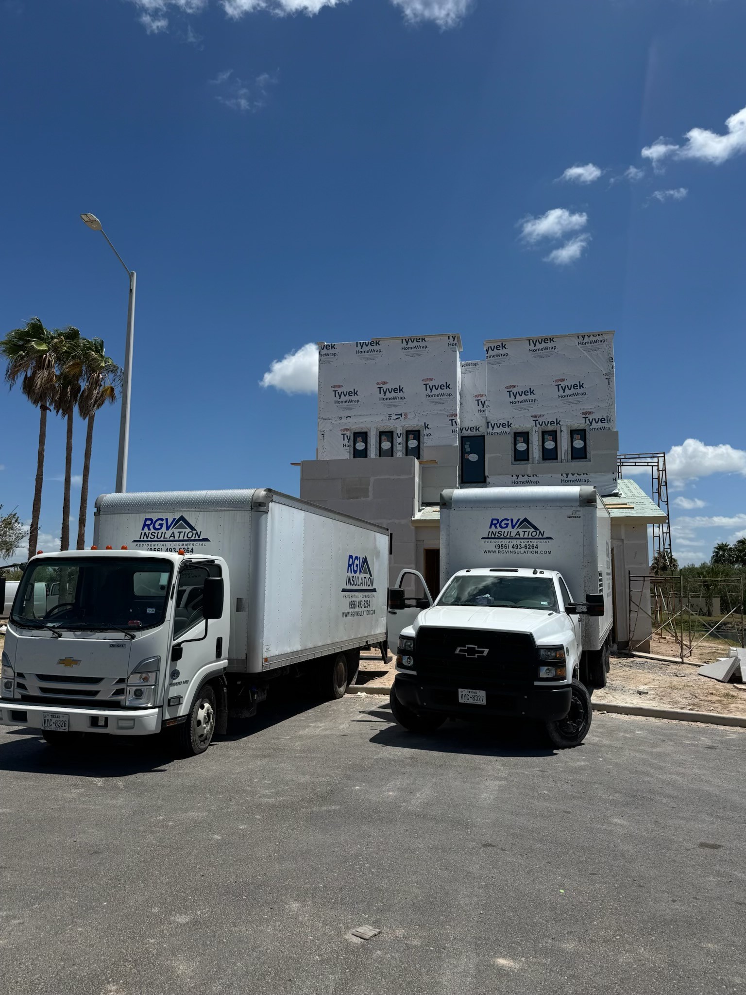RGV Insulation trucks on site with Tyvek insulation materials